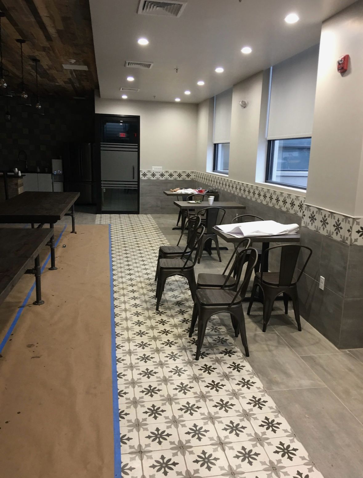 Modern finished basement with entertainment area and bar