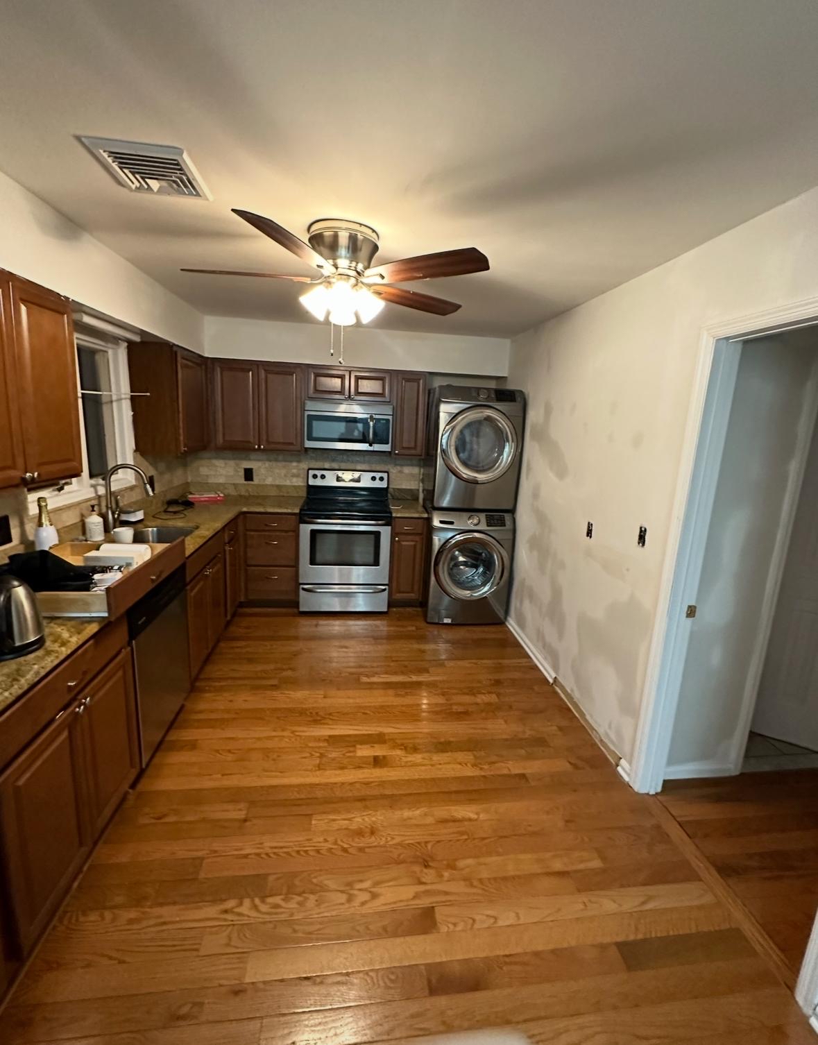 Skilled craftsman installing custom kitchen cabinets